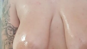 Sexy girl with big breasts in shower Breast massage